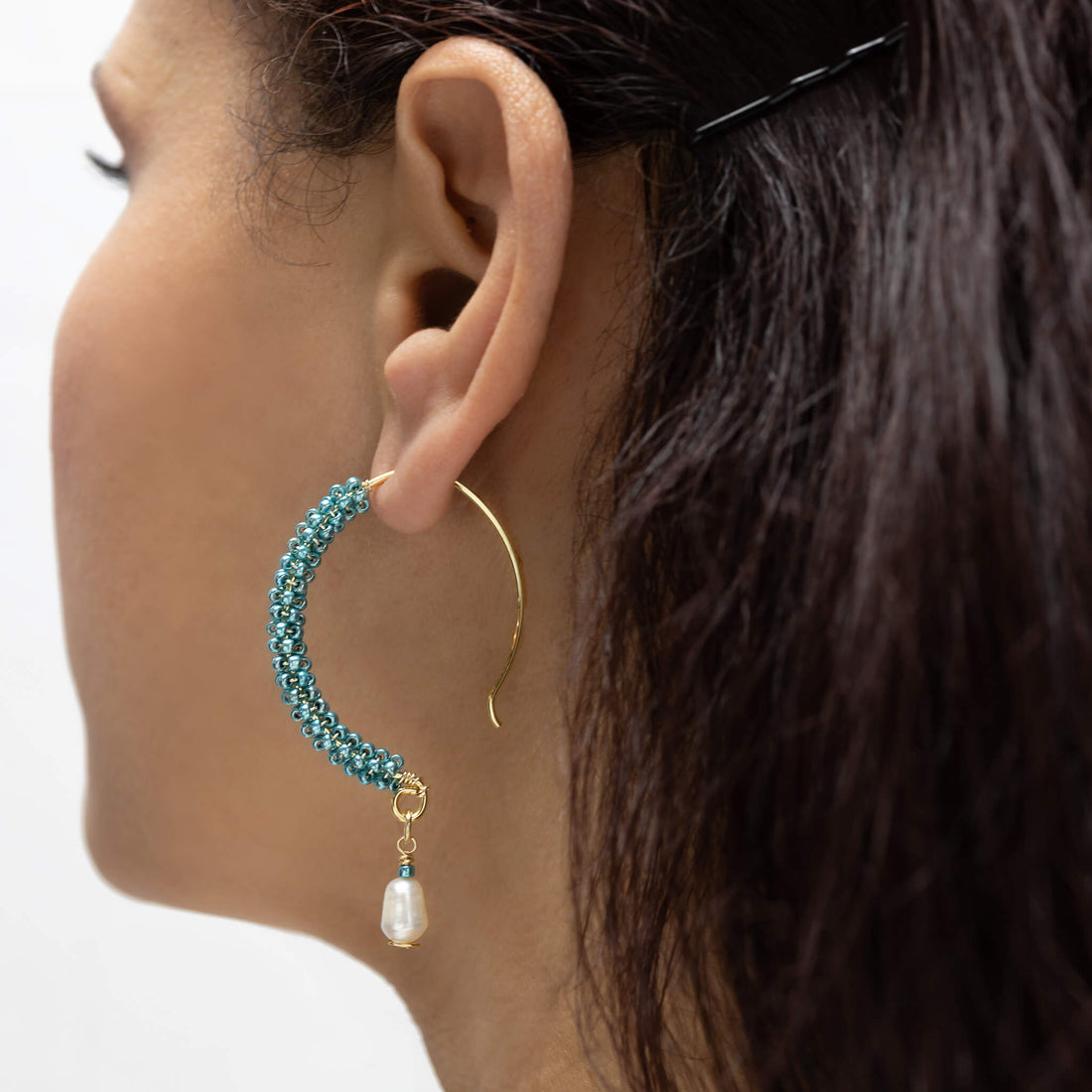 Ancora Gold Hoop Earrings are 2.5 inches long. Gold, Aqua, and White hoops. Handcrafted with Seed Beads Crystals, gold-plated wire, and freshwater pearl. Beaded Fish hook earrings.