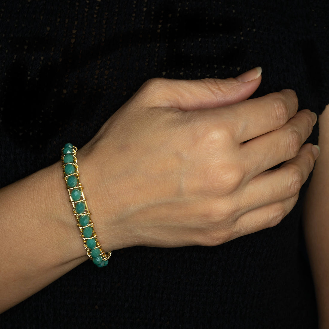 The Bogen Bracelet is one size fits all. Gold and aqua bracelet. Handmade with Non-tarnish gold plated wire and beads crystals. Wire-wrapped beaded bracelet