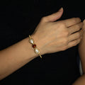 November Birthstone Crystal Gold Bracelet on a model. Brown Crystals, Fresh Water Pearls  and Non tarnish Gold color wire. Wire Wrapped Bracelet.