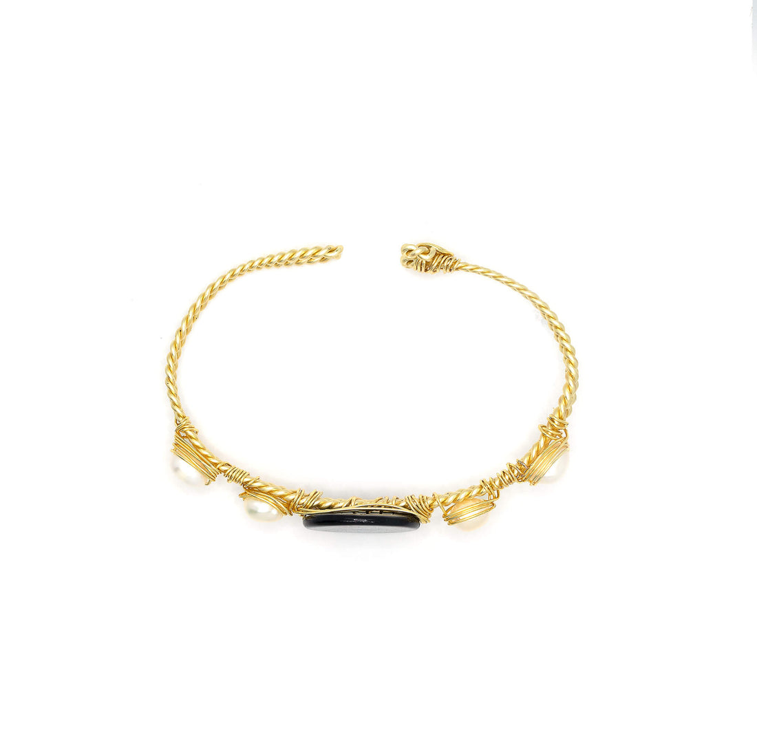 Dorfen Bracelet is one size fits all. Gold, black and white bracelet. Handmade with Non-tarnish Gold plated wire, mother pearls, and Fresh Water Pearls. Wire-wrapped bracelet.