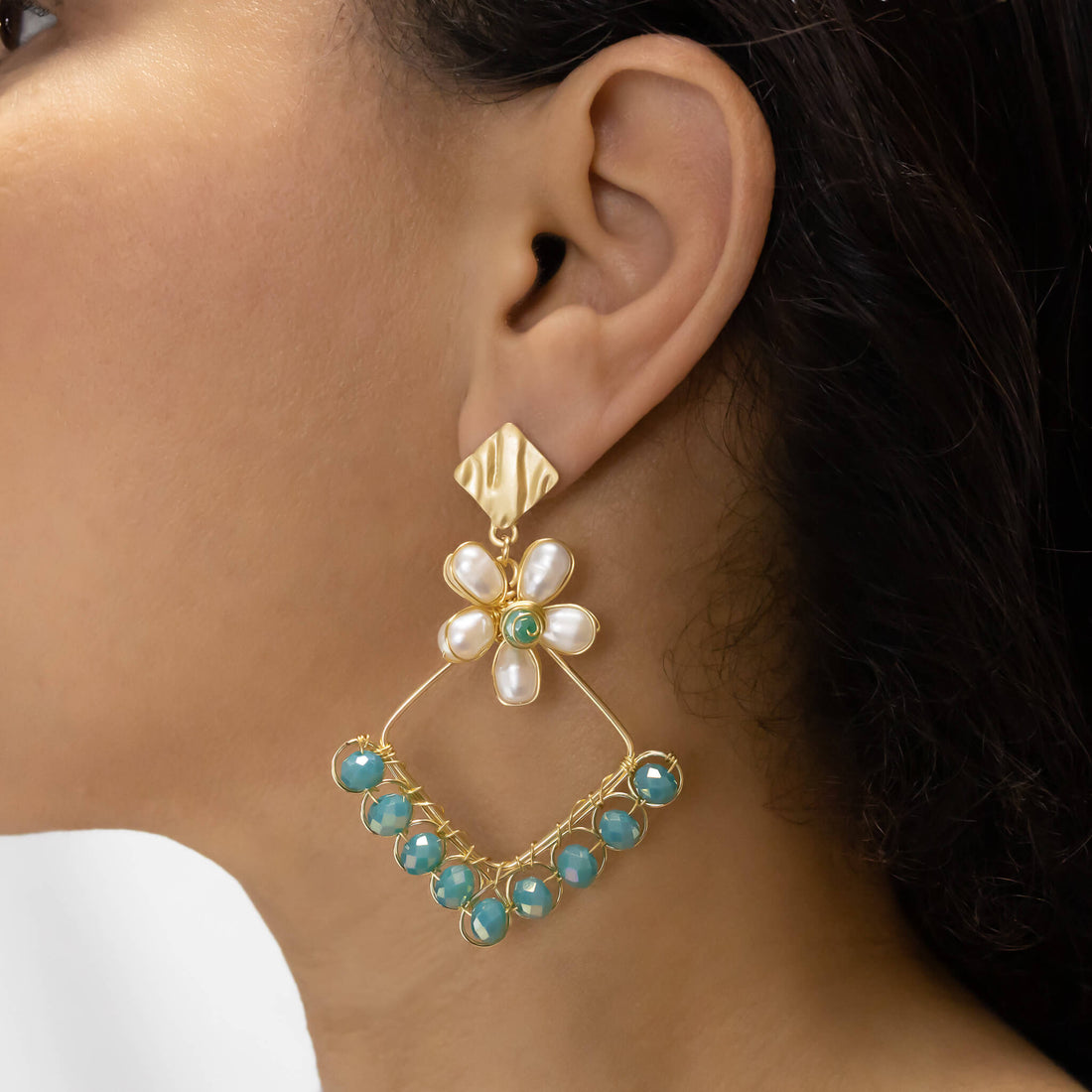 Geometric Earrings. The Mila earrings are almost 3 inches long, handmade with faceted crystals, freshwater pearls, and gold plated wire. The stud on these gold dangle earrings is hypoallergenic. Minimal wire wrapped earrings.