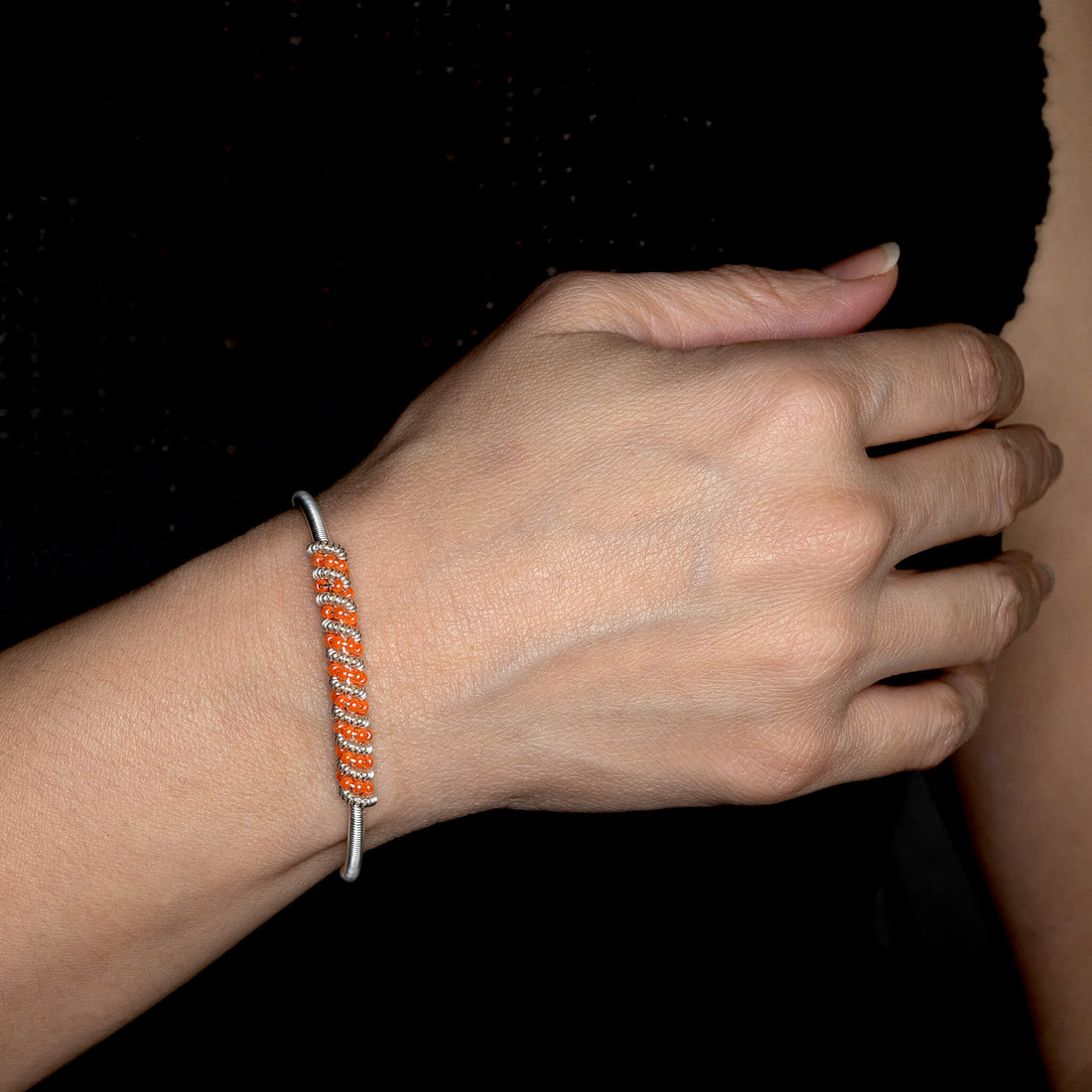 Siegen Bracelet is one size fits all. Silver and orange bracelet. Handmade with Non-tarnish silver wire and Czech seed beads crystals. Wire-wrapped beaded bracelet.