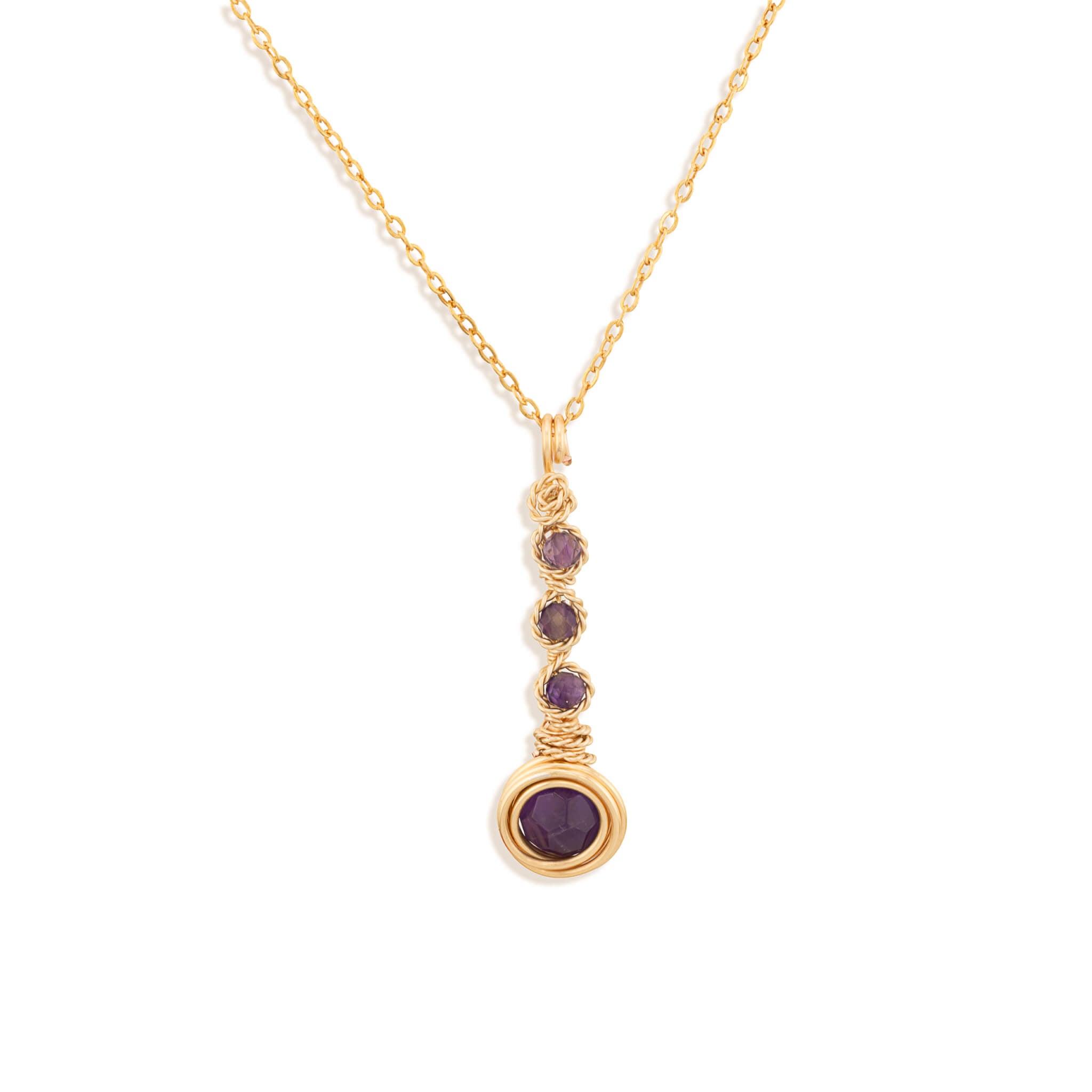A gold chain necklace with a vertical drop pendant featuring three small round purple Amethyst gemstones and a larger purple Amethyst gemstone at the bottom, set against a plain white background.