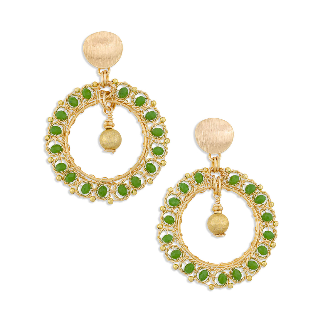 A pair of gold-toned statement dangle earrings featuring circular openwork wire frames accented with small green stones, a central gold bead drop, and a round textured gold post with a flat back.