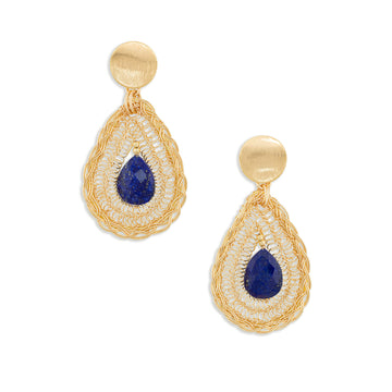 A pair of gold teardrop dangle earrings featuring a central deep blue lapis lazuli stone surrounded by textured gold wirework and small white stones, set against a plain white background.
