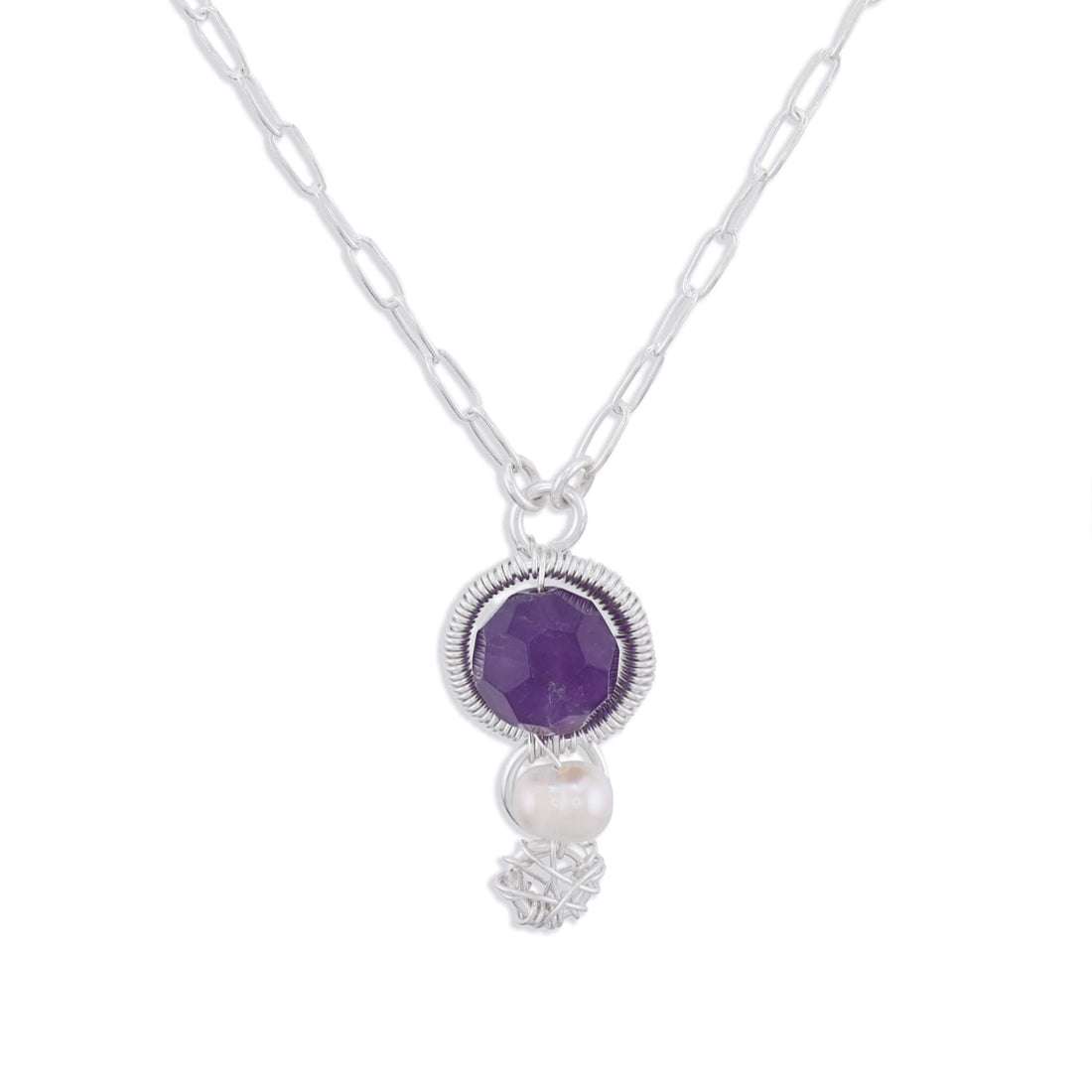 A silver paperclip chain necklace featuring a round purple amethyst pendant in a textured bezel setting, with a dangling white freshwater pearl and a small silver floral accent below, shown on a plain white background.