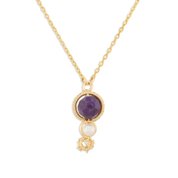 A gold chain necklace featuring a round purple amethyst pendant with a textured gold border, a small white pearl drop, and a tiny gold star charm, shown against a plain white background.