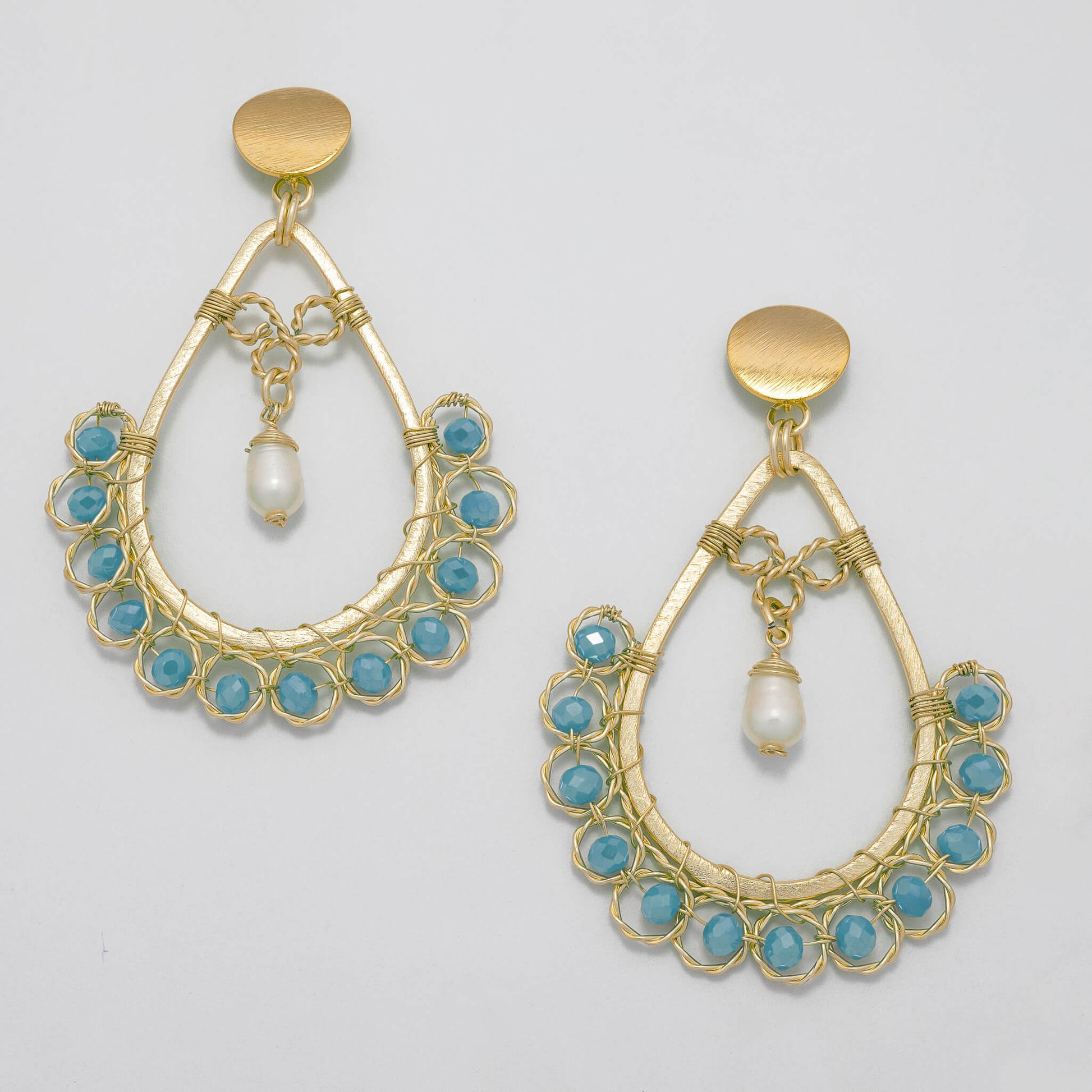 Amara I Earrings are 3 inches long. Gold teardrop Earrings. Gold, Light Blue, and White earrings. Handmade with Faceted Crystal beads and freshwater pearls. Wire Wrapped Earrings.