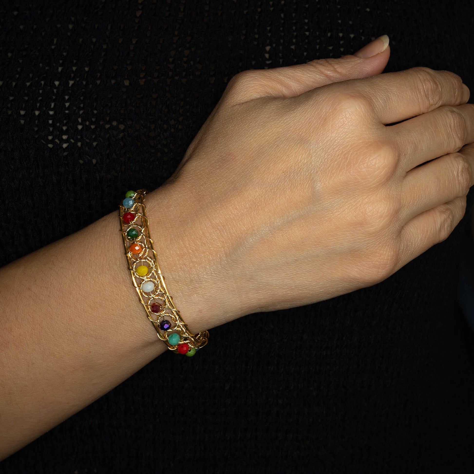 Aurich Bracelet on a model. Gold Color  Bracelet with Multicolor beads crystals. Wire wrapped bracelet. 