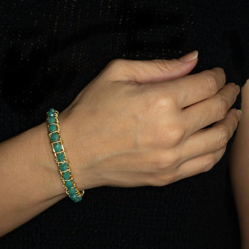 Bogen Bracelet on model. Gold Color  Bracelet with Aqua Green beads crystals. Wire wrapped bracelet. 