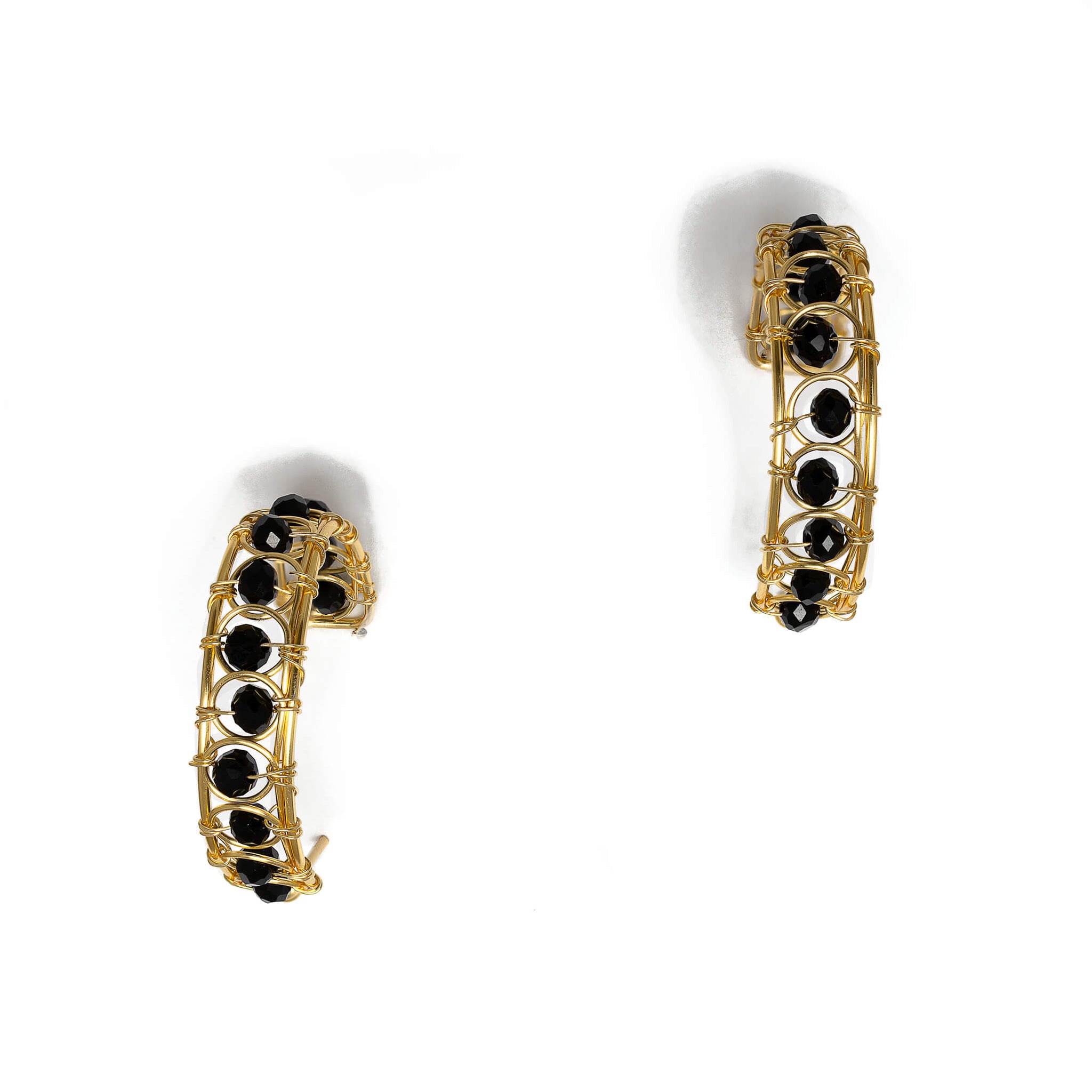 Catania Hoop Earrings are 1.25 inches long. Gold and black earrings. Handmade with gold-plated wire and faceted crystals. Beaded round Hoops. Simple Wire Wrapped Earrings
