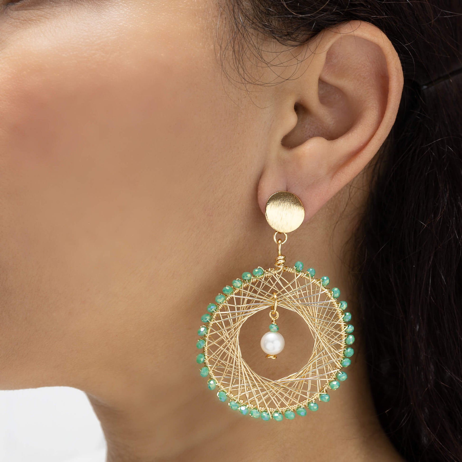 Farida Earrings on a model. Gold Color Earrings with Lime green Crystal Beads. and Fresh Water Pearls. Stud Earrings. Wire Wrapped Earrings.