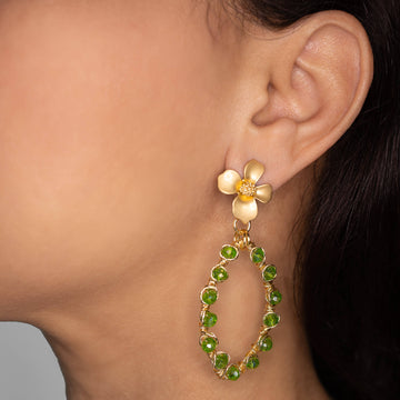 Hannah Earrings on a model. Gold Color Earrings with Green Crystal Beads. Flower Stud Earrings. Metal Frame & Wire Wrapped Earrings