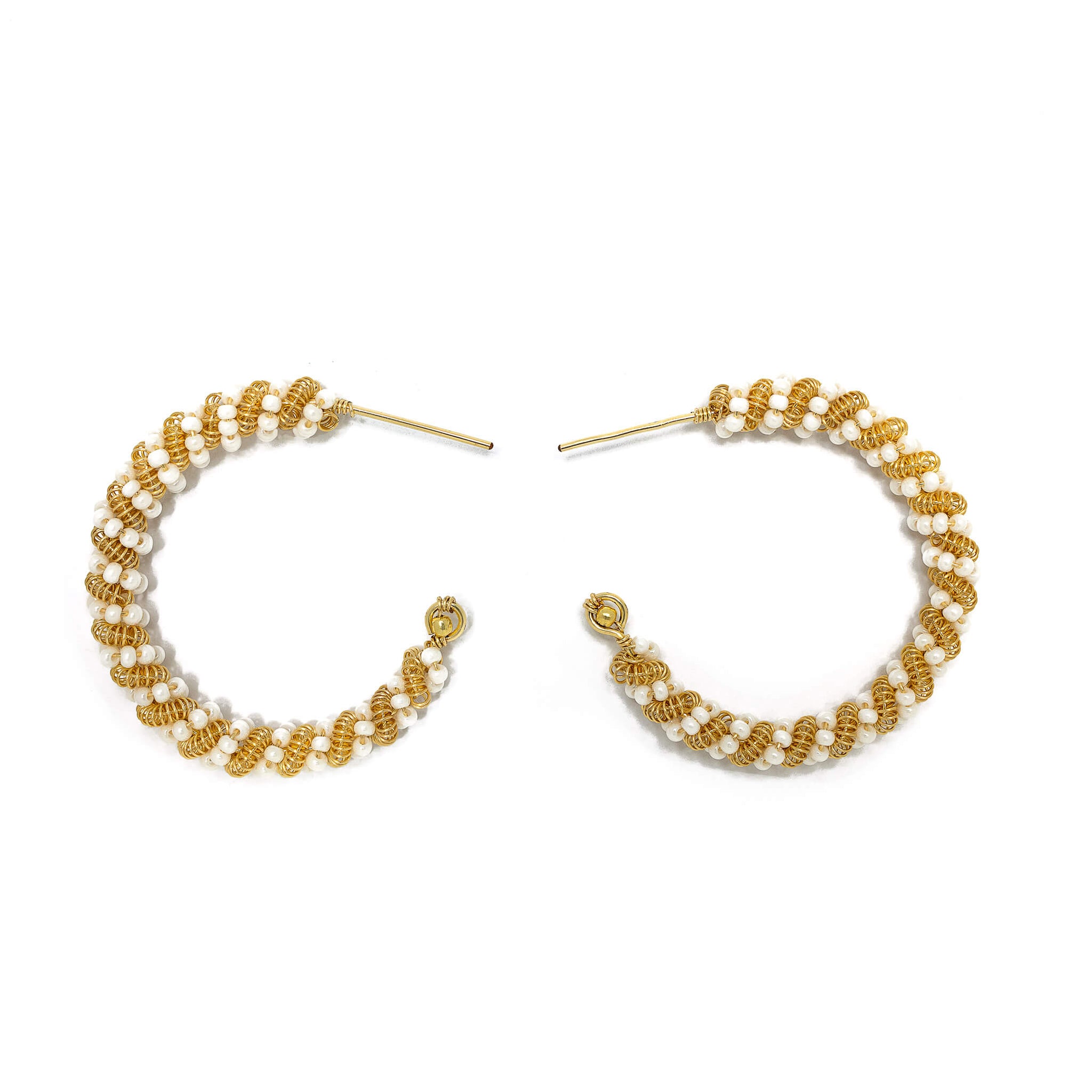 The Milan Hoop Earrings are 1.5 inches long. Minimalist Gold and white earrings. Wire Wrapped Earrings. Handmade Gold beaded earrings. Feature gold-plated wire and Czech seed bead crystals. Wire earrings.