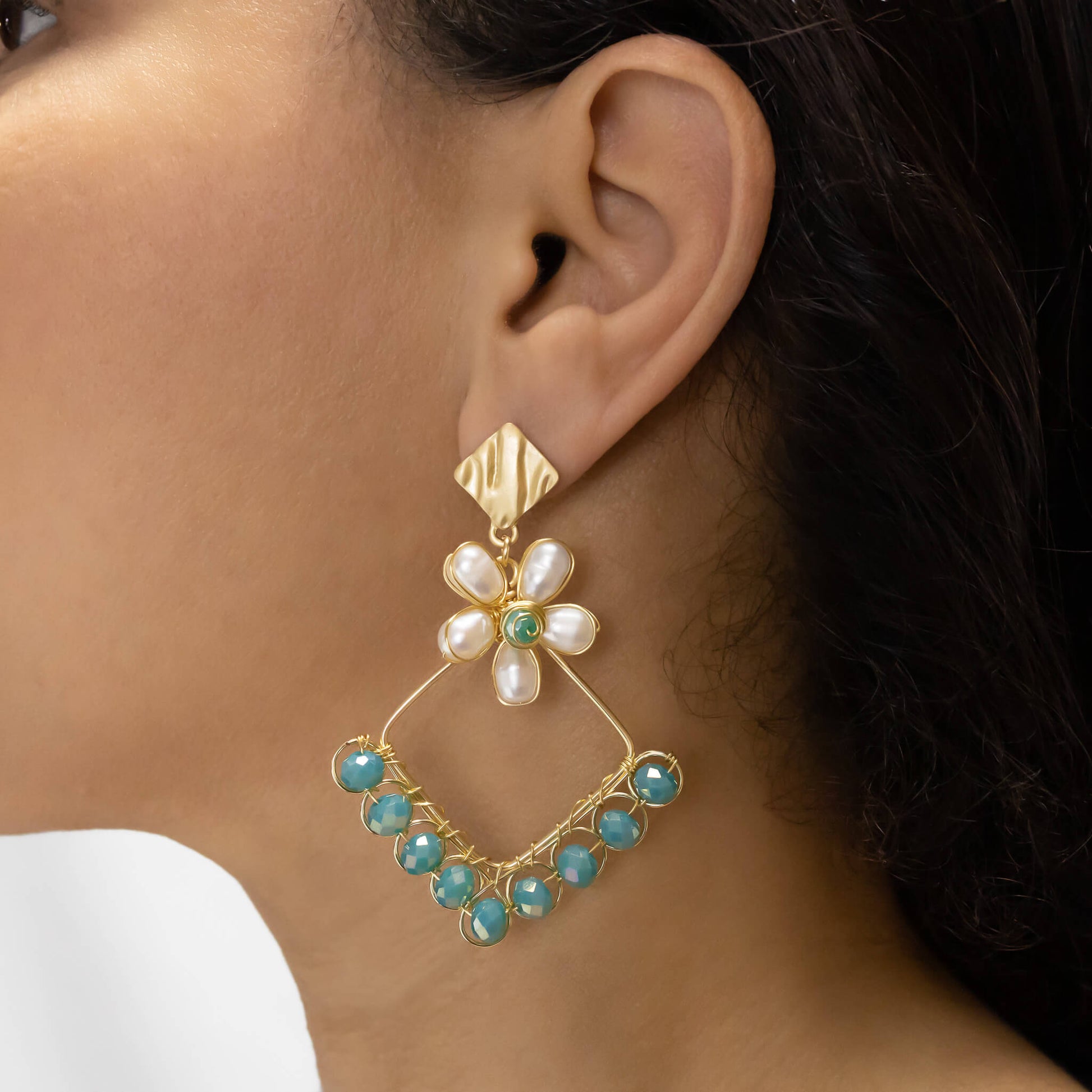 Mila Earrings on a model. Gold Color Earrings with  green Crystal Beads and fresh water pearls. Stud Earrings. 
