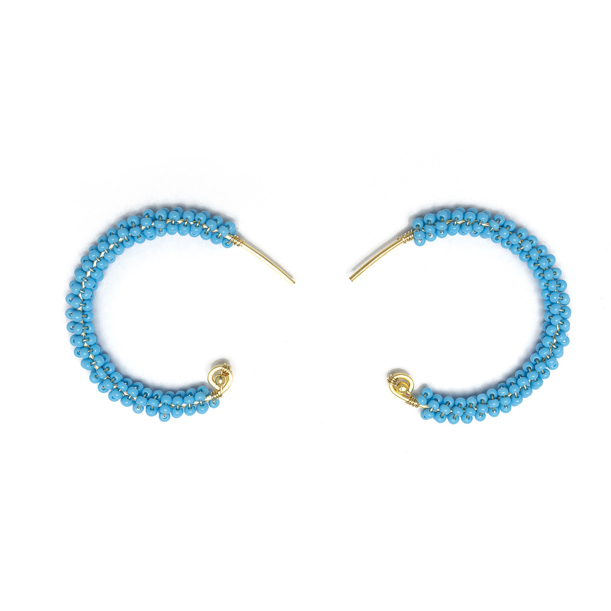 Florence gold Hoop Earrings are 1.5 inches long, Gold and Baby Blue Earrings. Wire Wrapped Earrings. Lightweight and comfortable earrings. Handmade for women. Open hoop earrings.